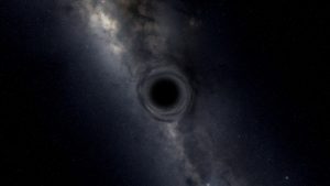 Чёрная дыра на фоне туманности